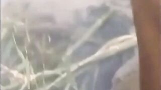 Asian bodybuilder barely covered at the beach